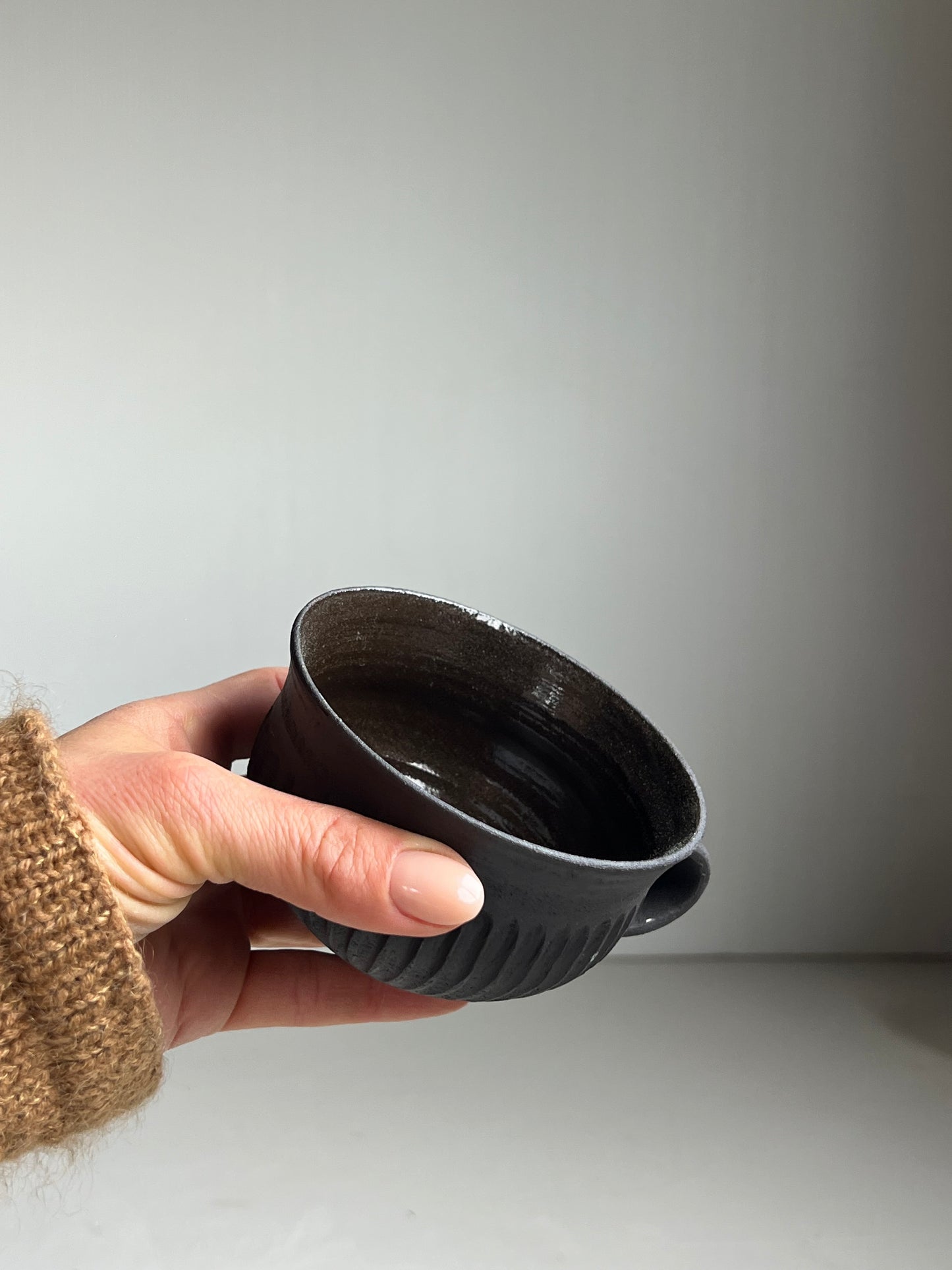 Black Clay fluted cup unglazed outside