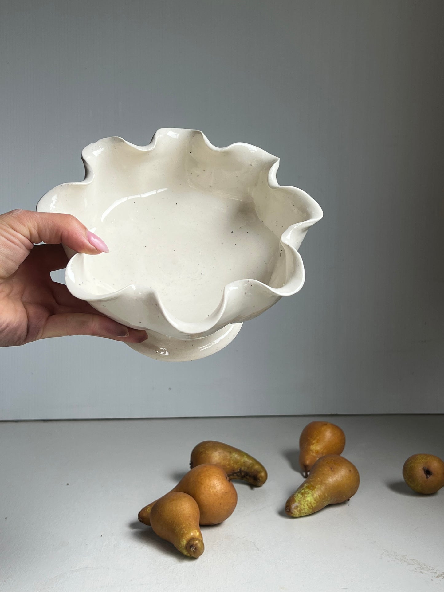 Scalloped bowl on pedestal