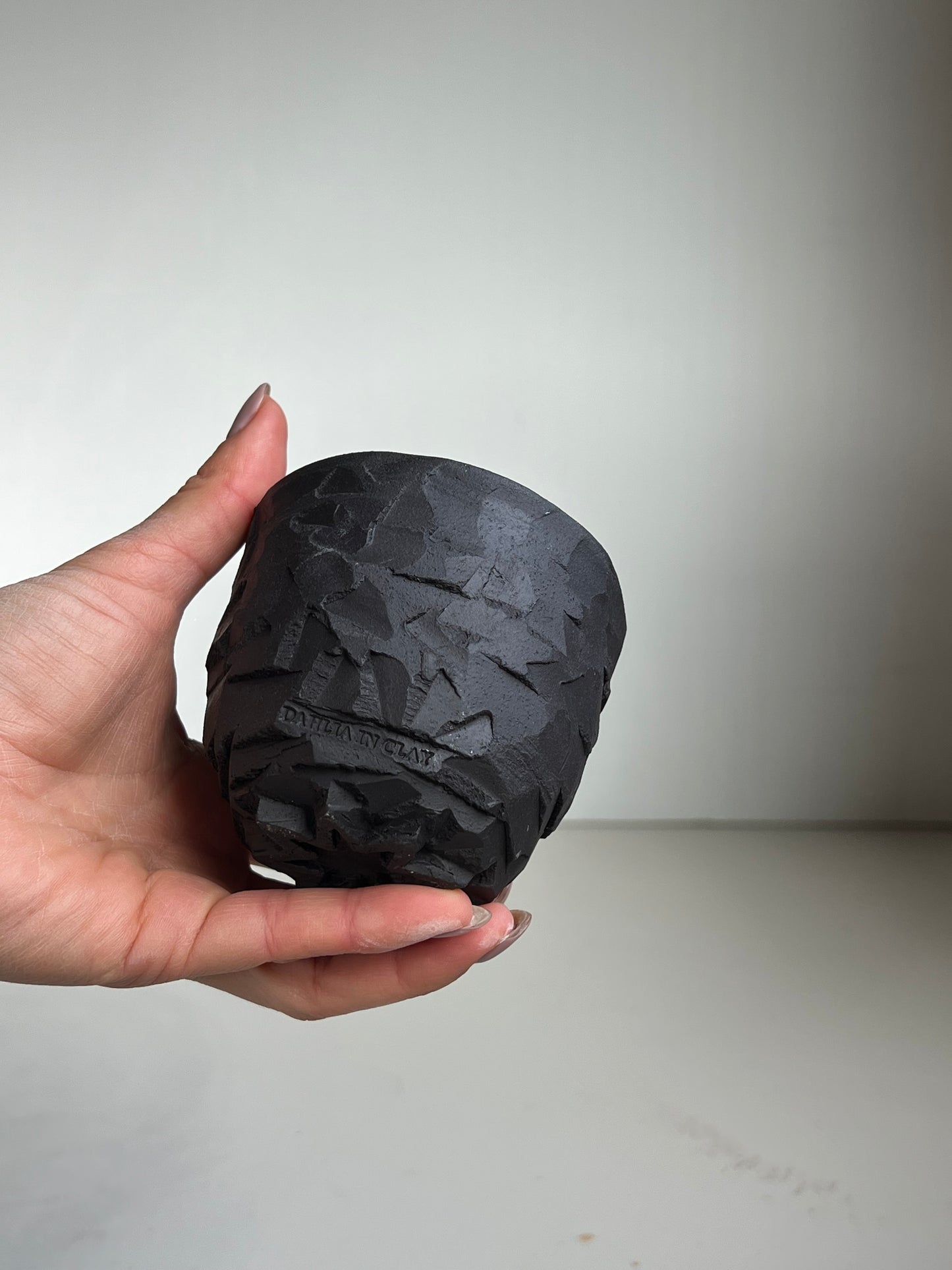 Black Clay large Kurinuki Cup with flower foot.