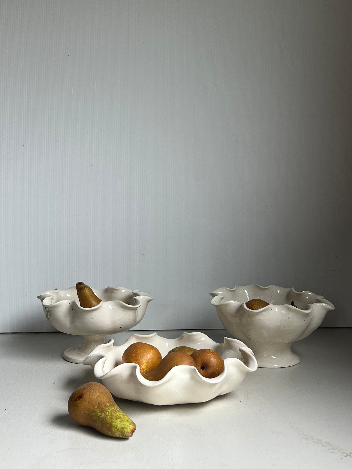 Scalloped bowl on pedestal