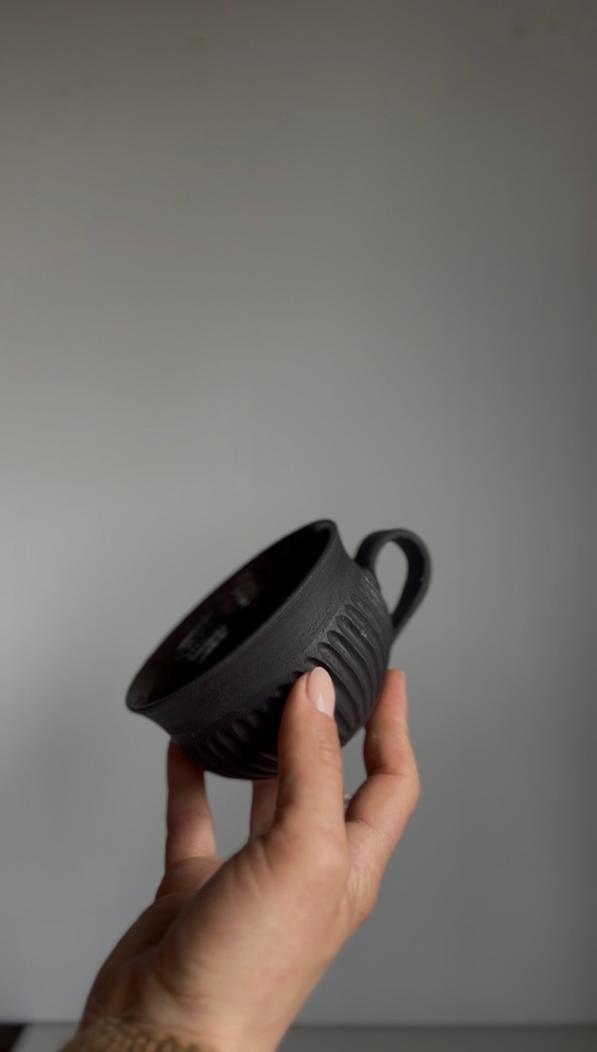 Black Clay fluted cup unglazed outside