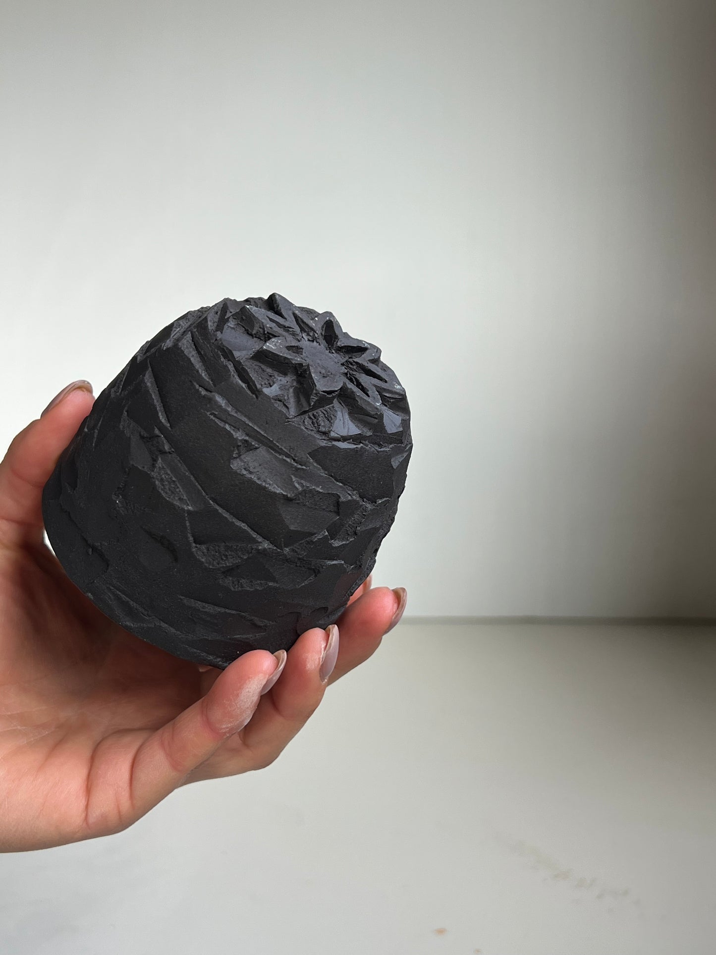 Black Clay large Kurinuki Cup with flower foot.